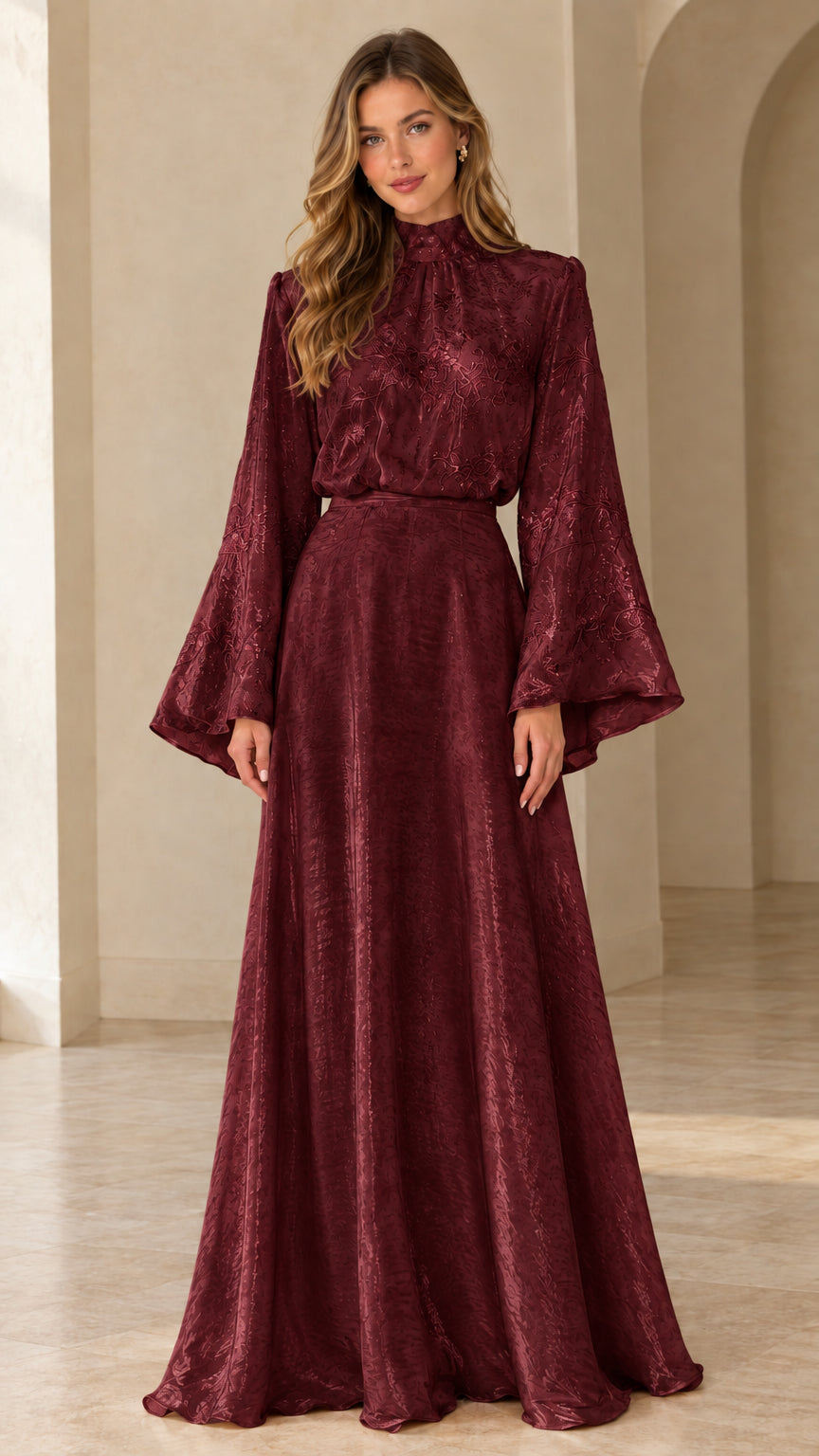 Front full view of woman wearing burgundy wine red high neck bell sleeve evening gown