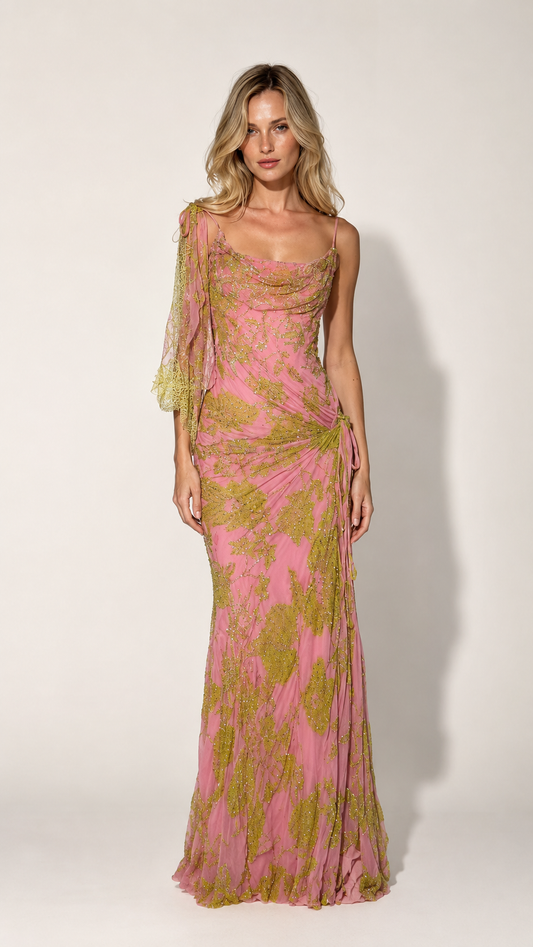 Front view of pink one-shoulder draped sequin mesh maxi gown with sheer sleeve and ruched side detail