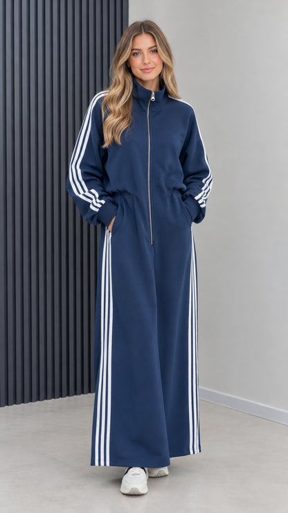 Front view of model wearing navy blue sporty full-zip striped maxi track dress