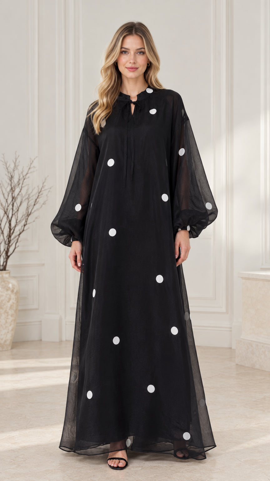 Front full view of black polka dot balloon sleeve maxi dress
