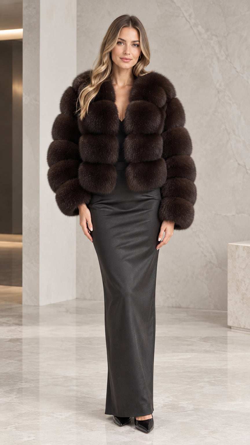 Front view of model wearing the espresso brown plush faux fur cropped jacket styled with a black maxi gown