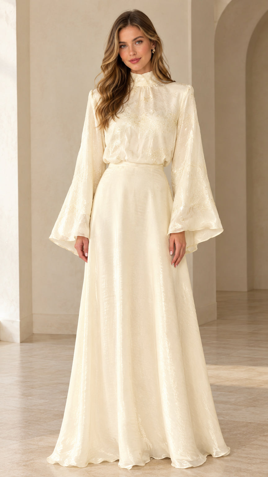 Front full view of woman wearing ivory high neck bell sleeve jacquard maxi dress