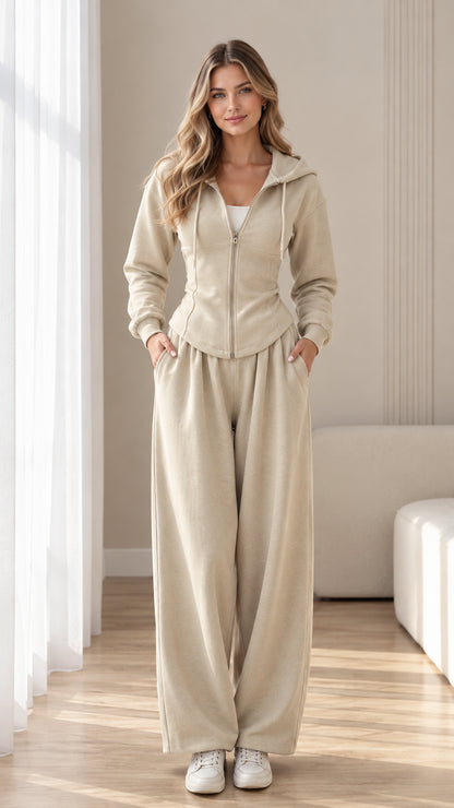 Front view of model wearing beige lace-up corset zip hoodie and wide-leg sweatpants set