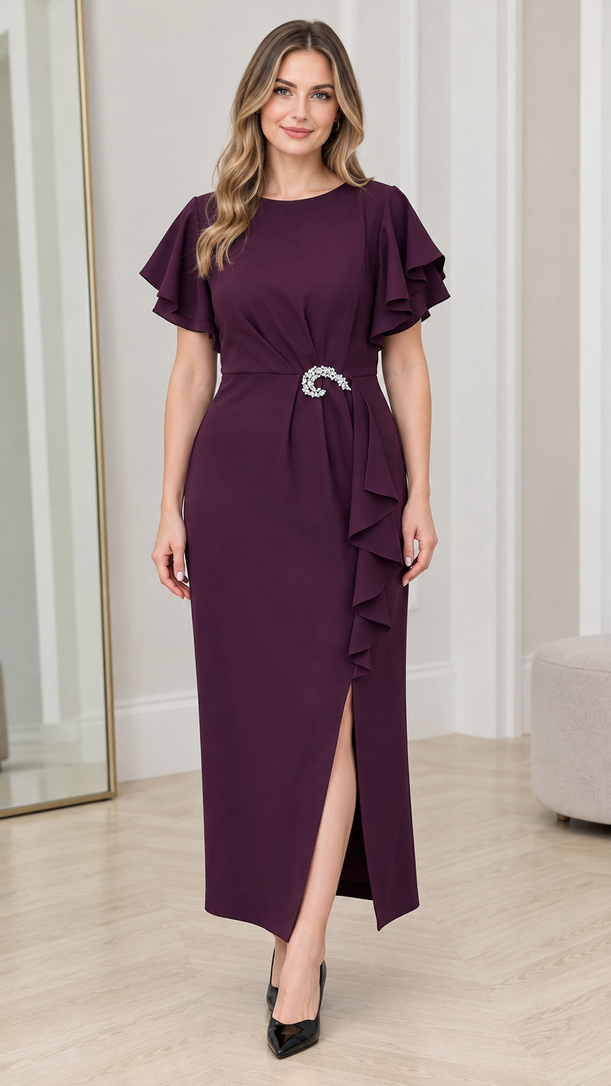 Front full view of woman wearing Plum flutter sleeve maxi dress with crystal brooch and side slit