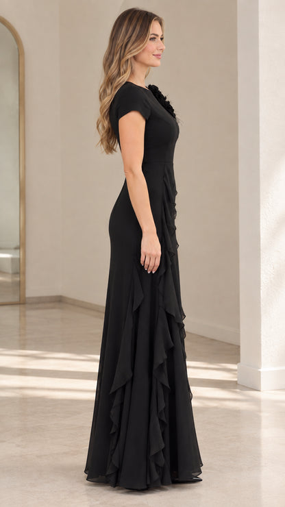 Side view of black formal maxi gown showing elegant silhouette and draped side ruffles