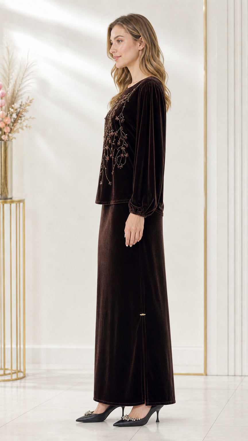 Side full-length view of dark brown velvet matching set showing the skirt side slit
