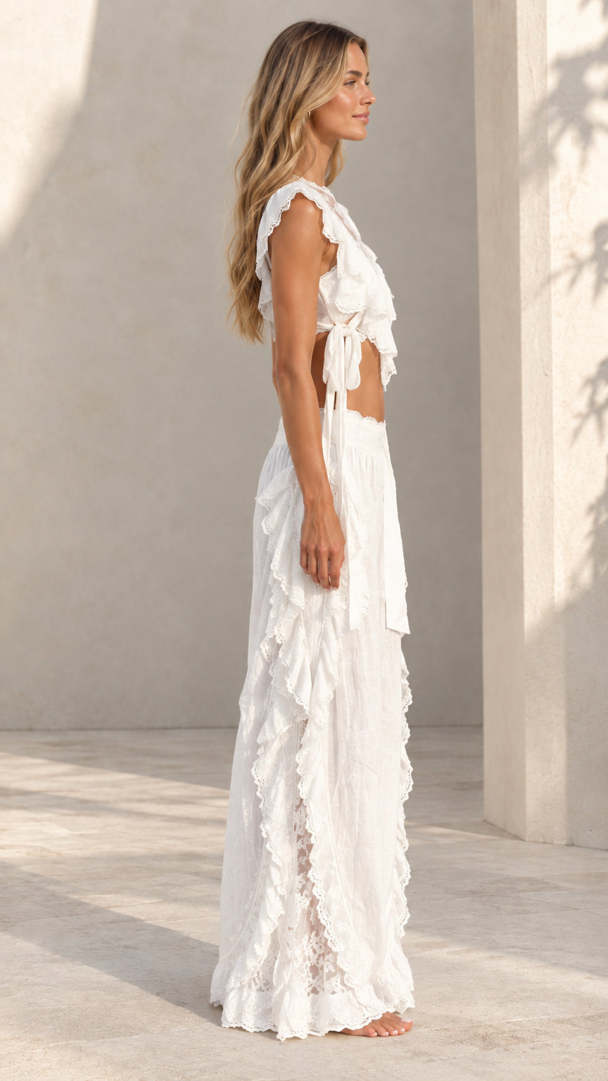 Side view of woman wearing white lace-accented two-piece matching set