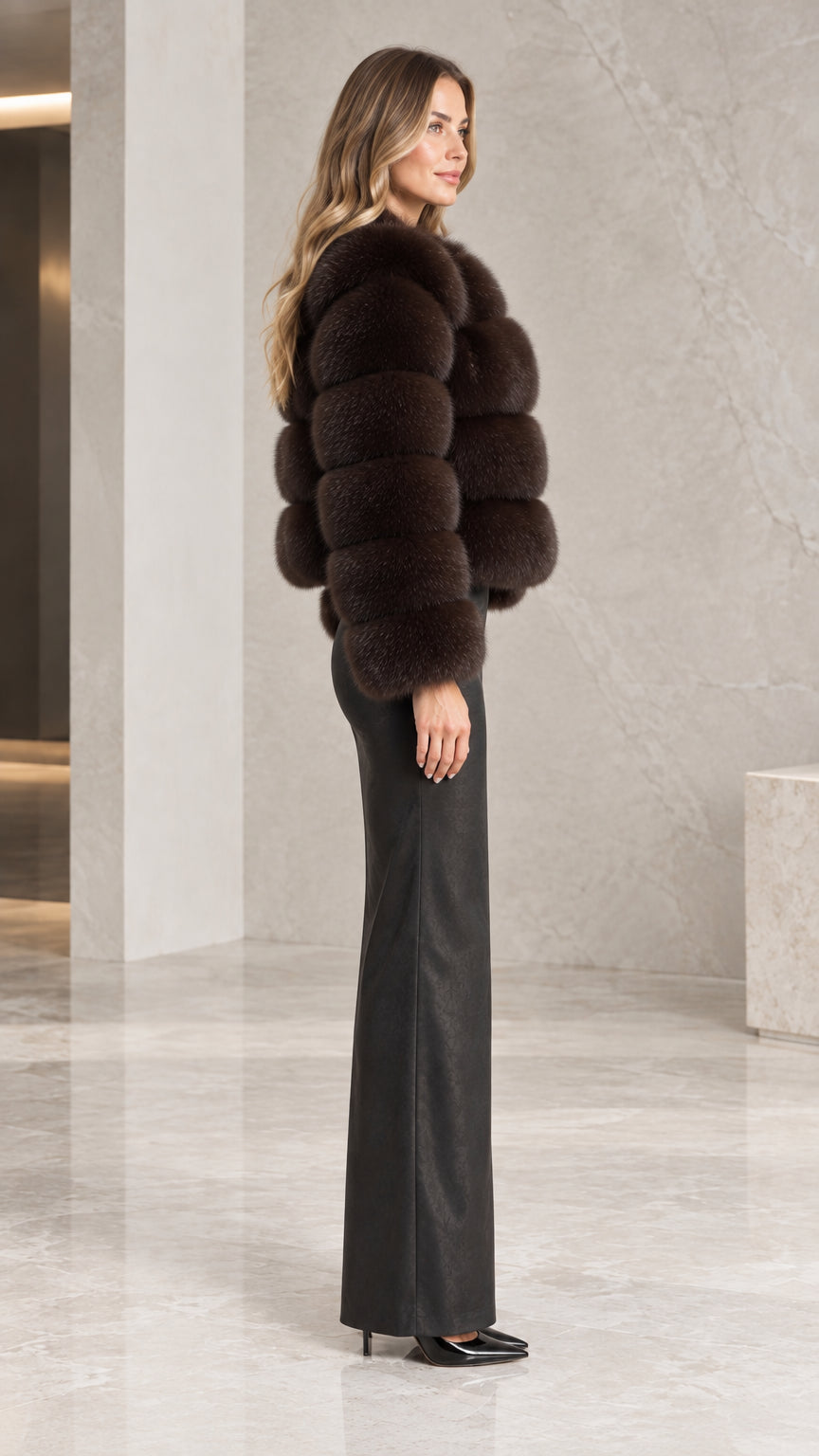 Side profile view of the espresso brown tiered faux fur jacket showing cropped silhouette