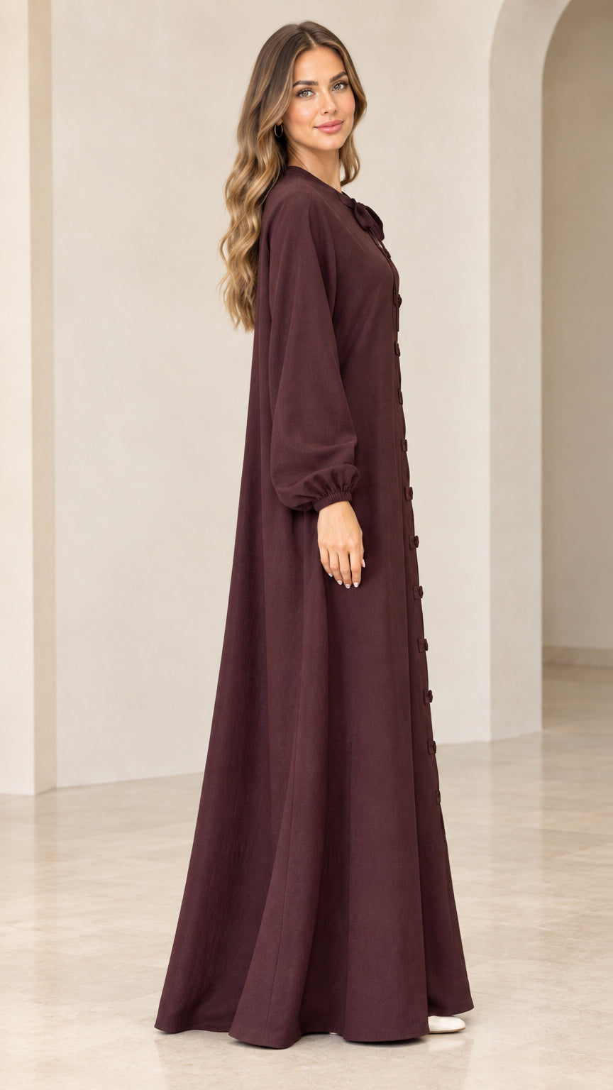 Burgundy long sleeve maxi dress side view showing loose drape