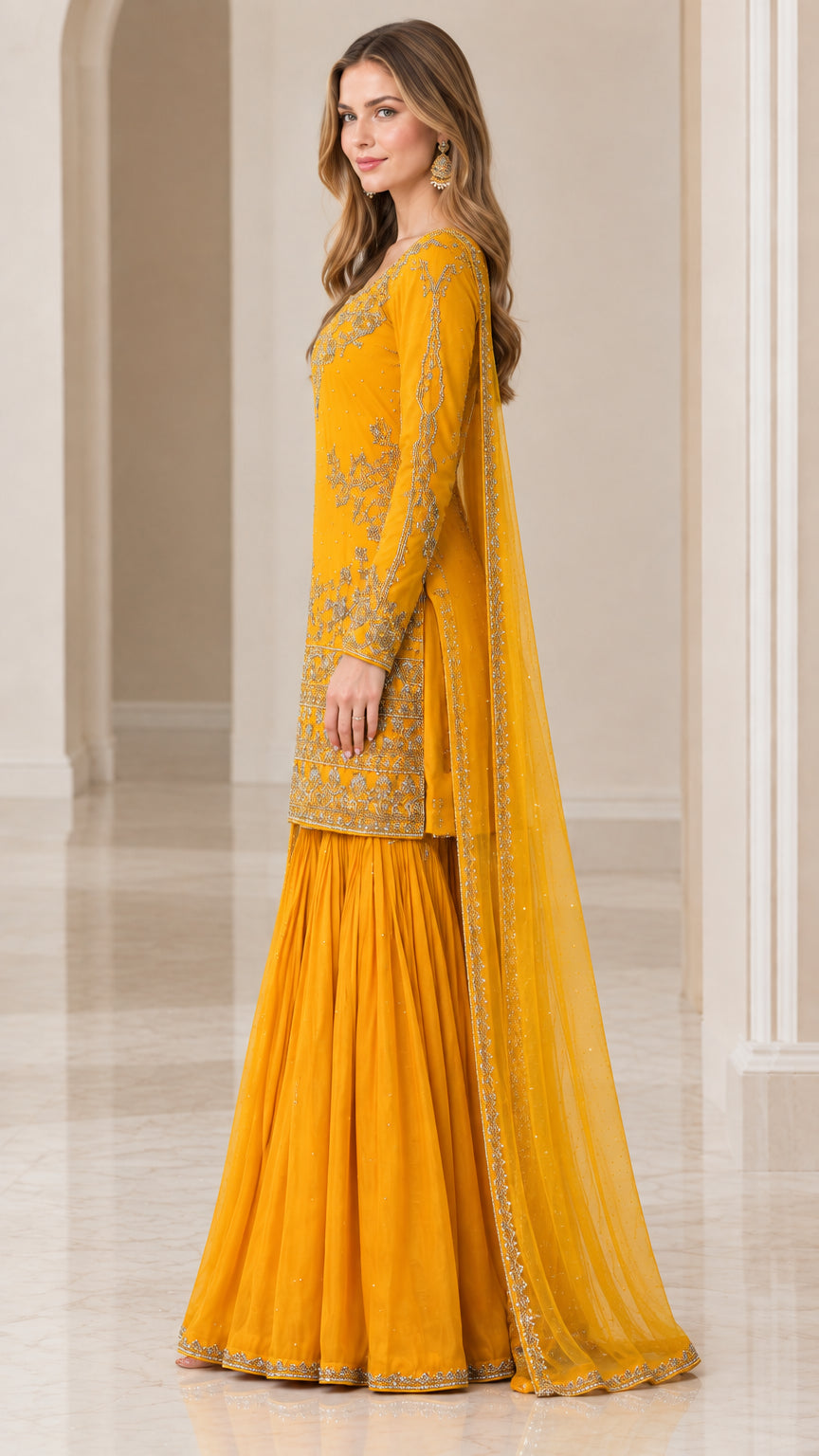 Side view of woman wearing Mustard Yellow embroidered 3-piece sharara suit