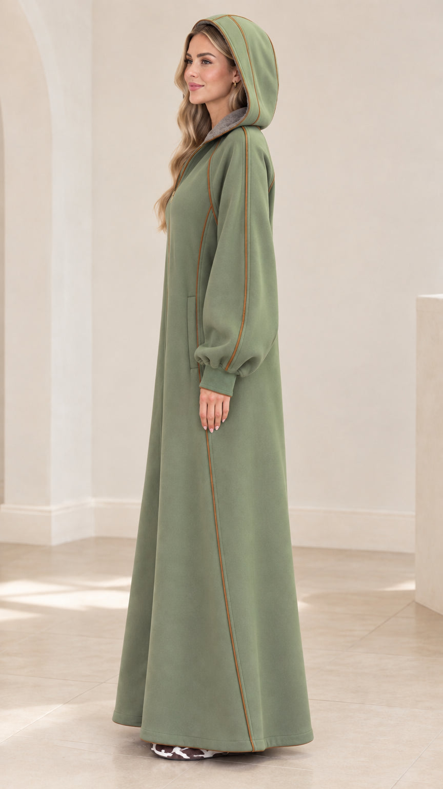 Side view of sage green hooded maxi robe coat with contrast piping