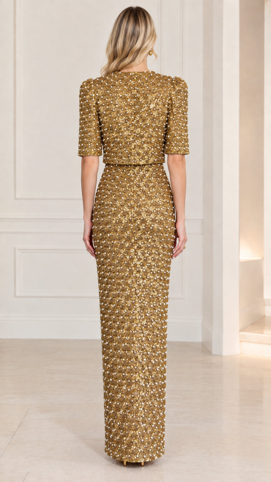 Back view of gold sequin evening dress and short sleeve jacket set