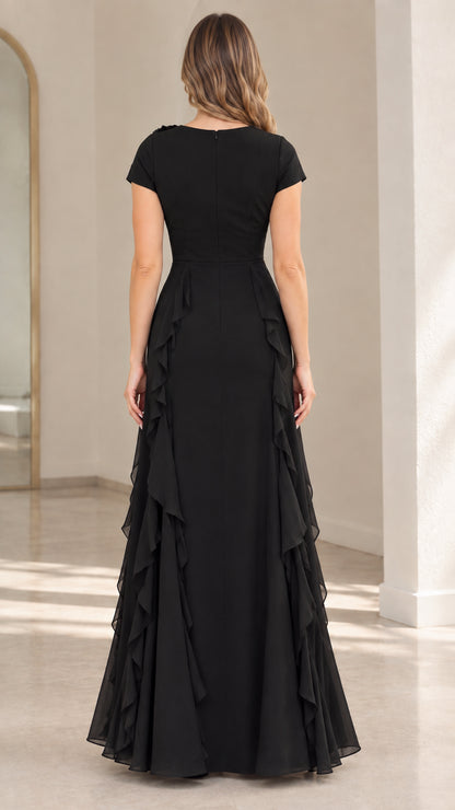 Back view of black floor length evening dress featuring clean tailored fit and cascading ruffles
