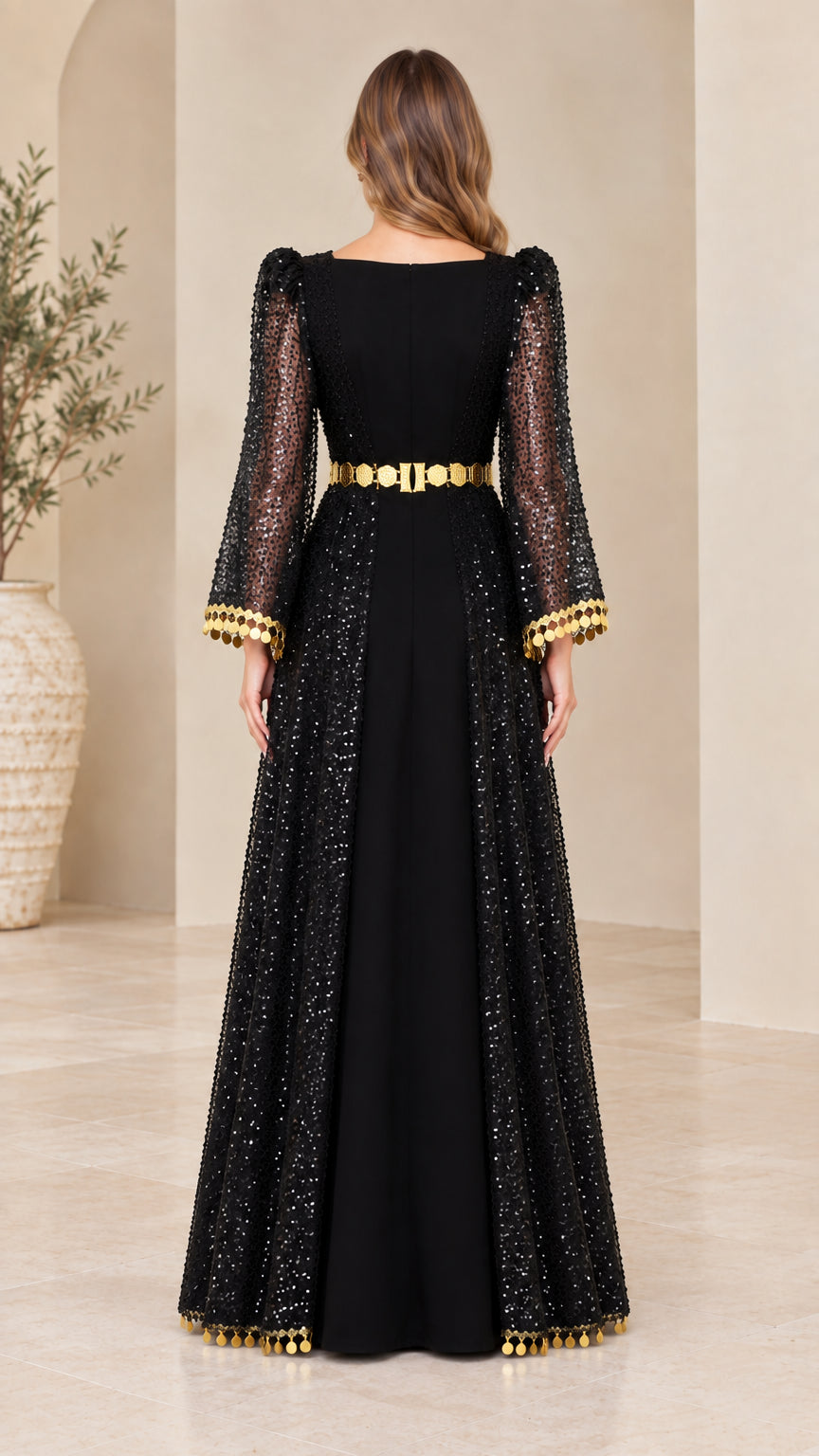 Back view of black sequin overlay maxi dress with long bell sleeves