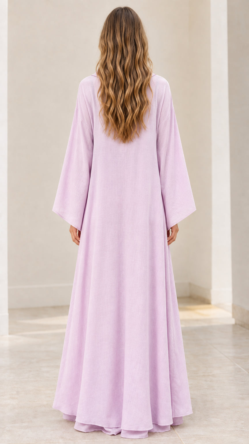Back view of model wearing floor-length light purple kaftan dress