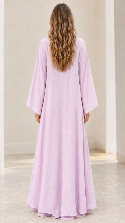 Back view of model wearing floor-length light purple kaftan dress