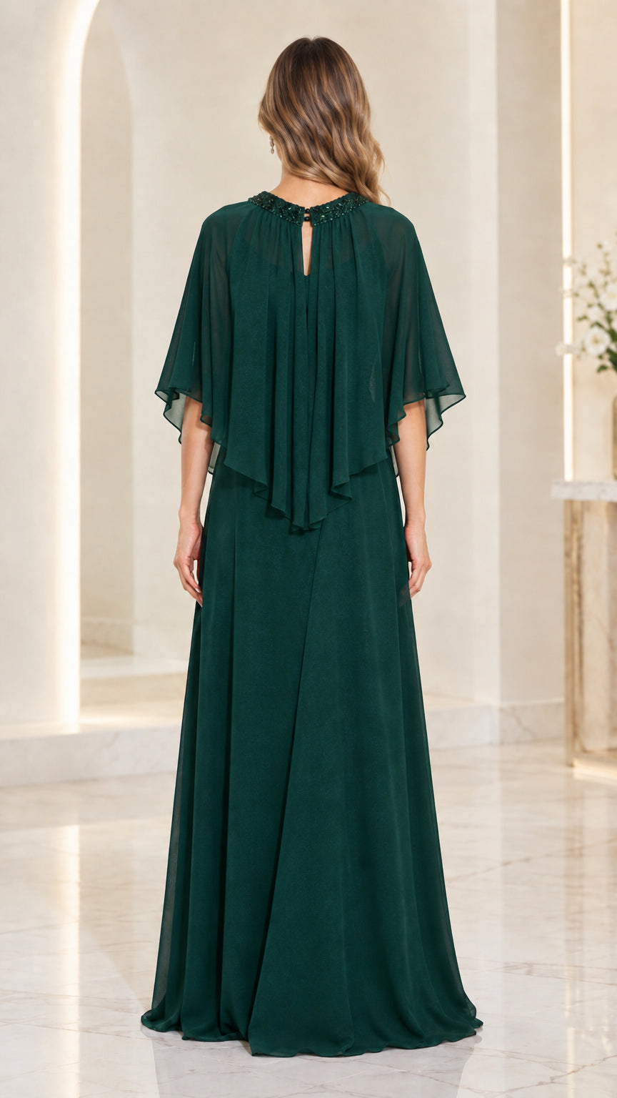 Back view of dark green chiffon formal dress featuring back keyhole detail