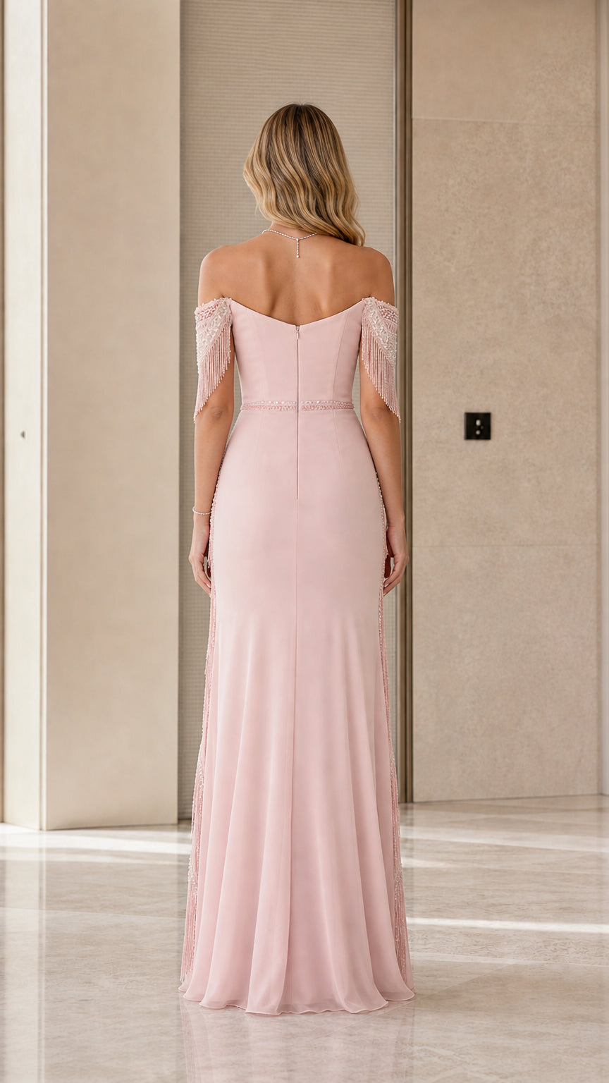 Back view of dusty rose maxi gown showing fitted bodice and flowing hemline