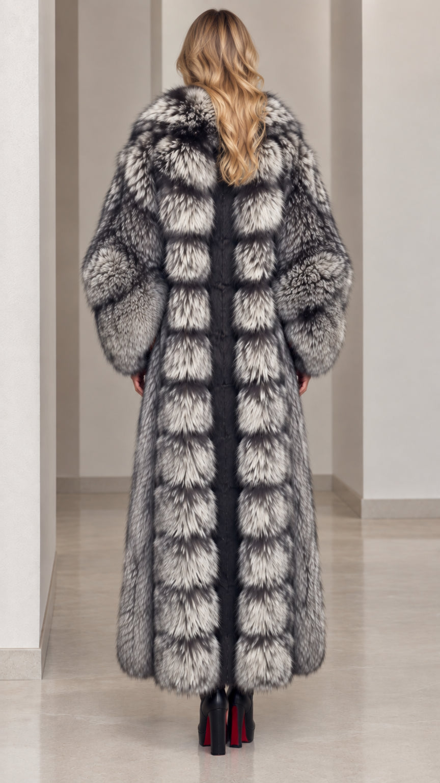 Back view of model in paneled silver grey full-length faux fur coat