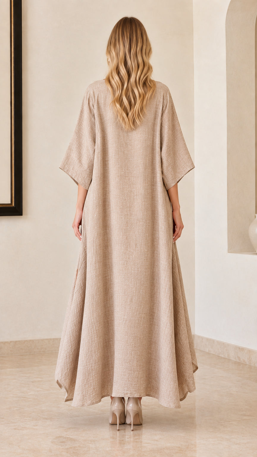 Back view of woman wearing beige relaxed kaftan maxi dress