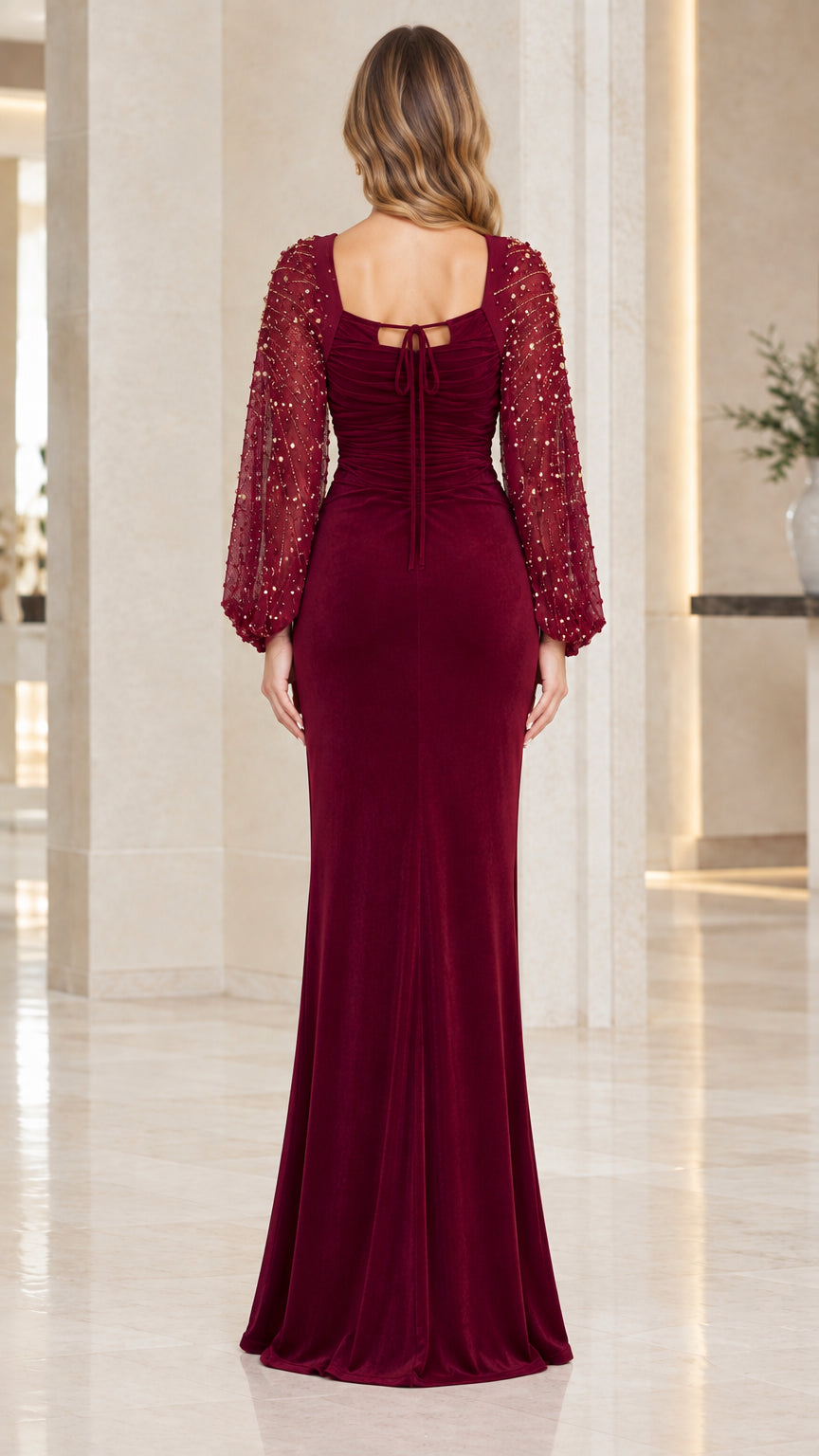 Back view of burgundy velvet formal gown showing tie back detail