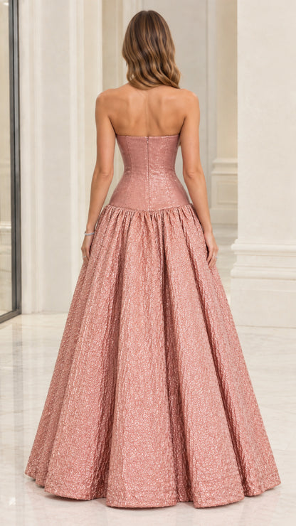 Back view of model in Rose Gold strapless evening gown showing zip closure