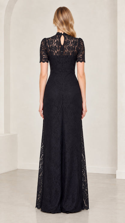 Back full-length view of model in black lace jumpsuit showing back keyhole detail
