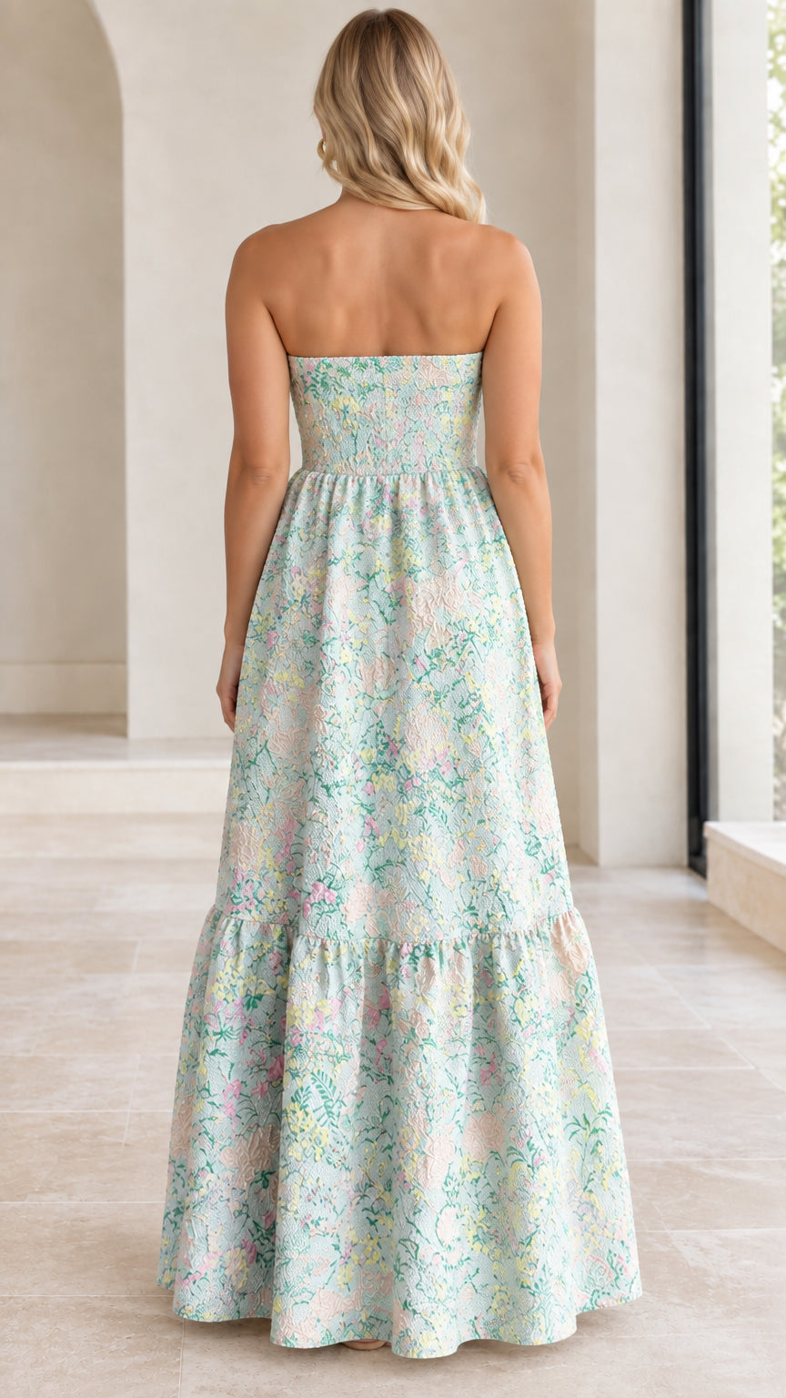 Back view of mint green strapless maxi dress showing smocked back panel