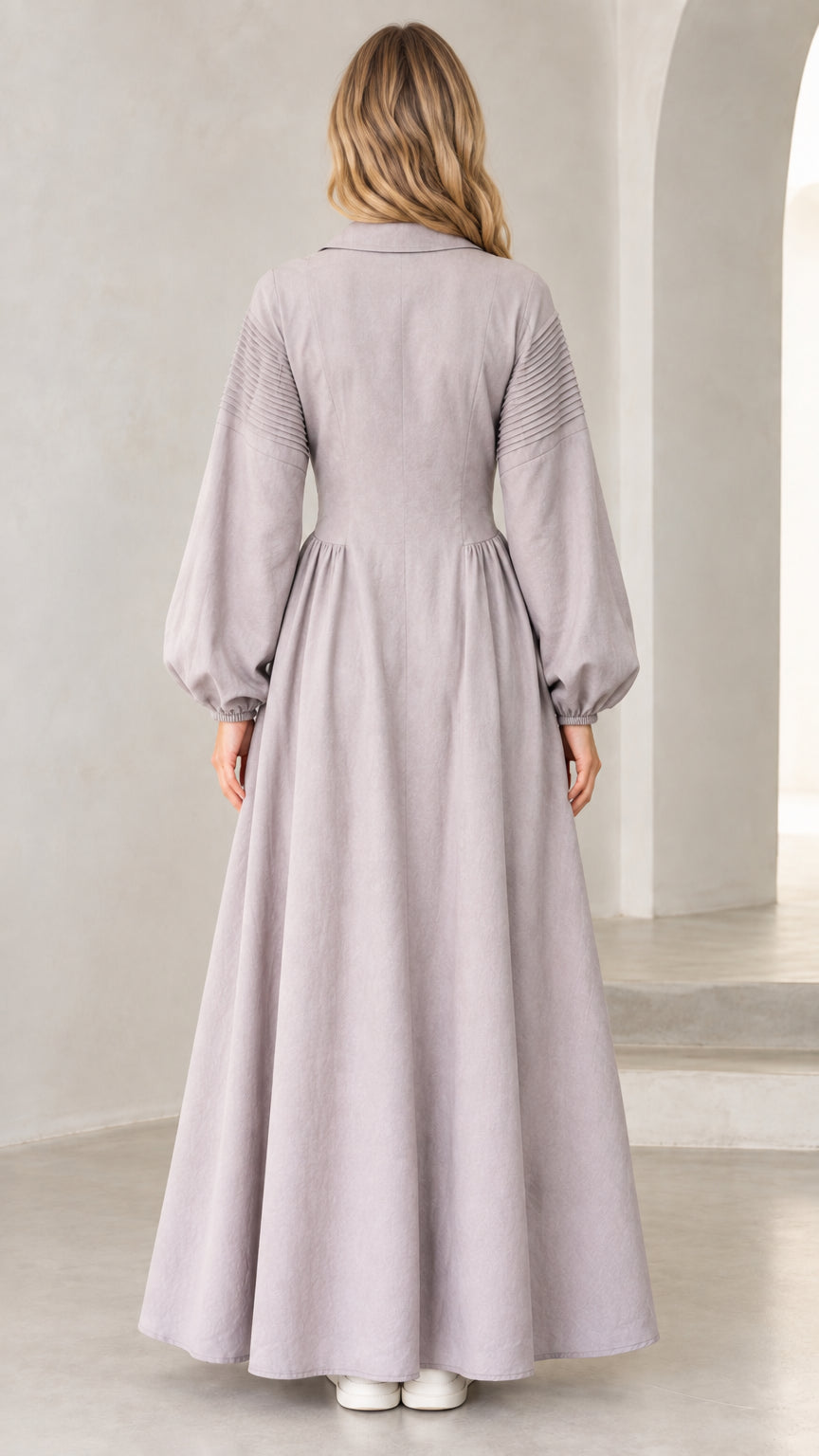 Back view of woman wearing lavender grey long sleeve maxi dress
