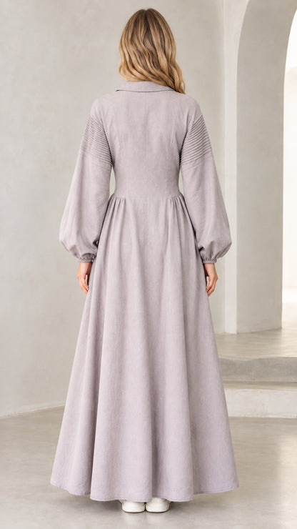 Back view of woman wearing lavender grey long sleeve maxi dress