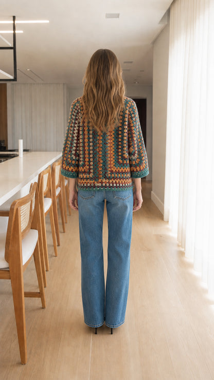 Back view of woman wearing geometric pattern crochet open front cardigan