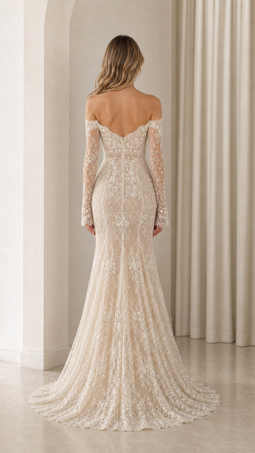 Back view of Ivory off-the-shoulder lace gown highlighting low back and sweeping hem