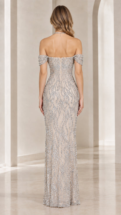 Back view of champagne sequin gown showing back zipper and off-shoulder straps