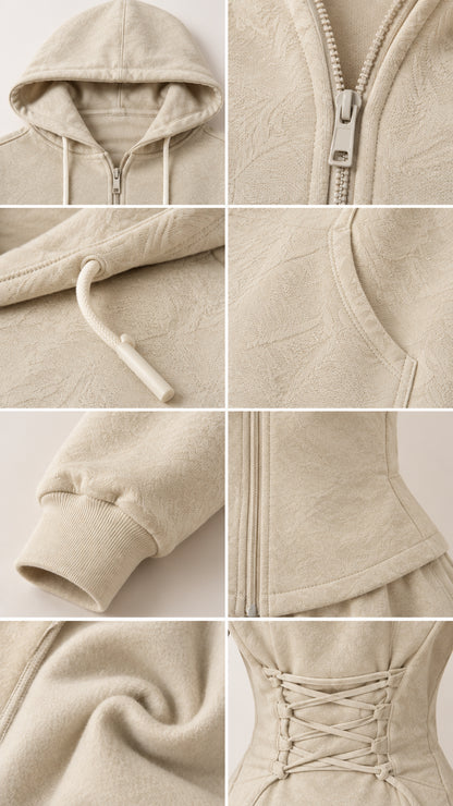 Close-up details of hoodie drawstring, zipper, textured fabric, and back corset laces