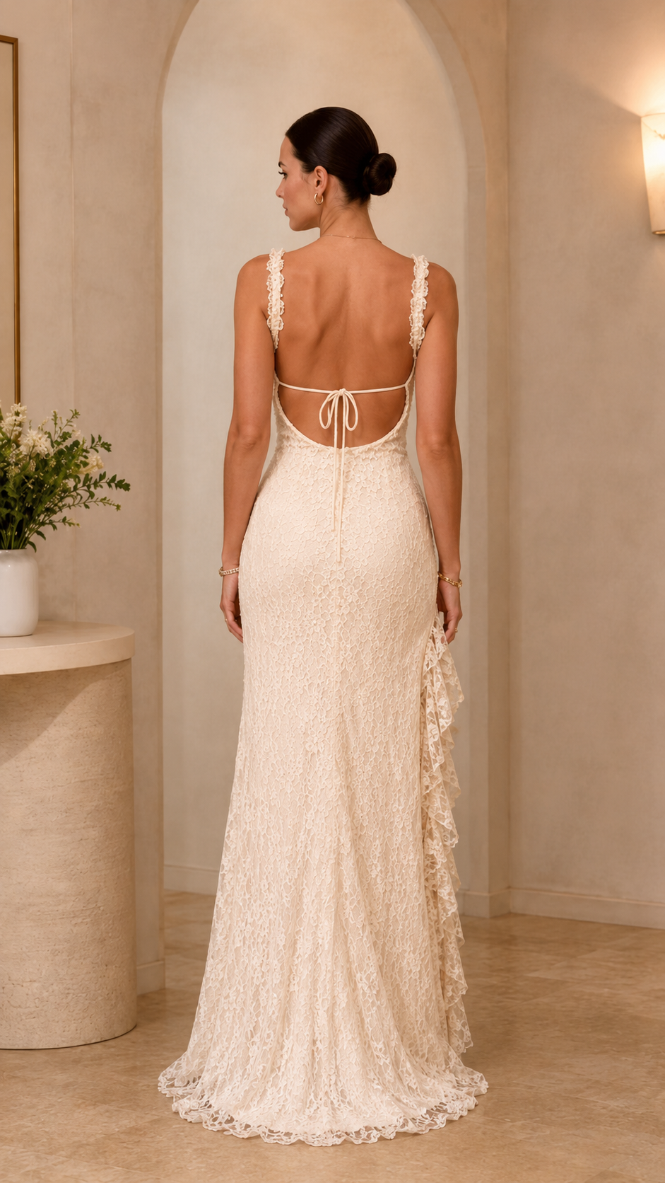 Back view of ivory lace maxi dress with open back and tie detail