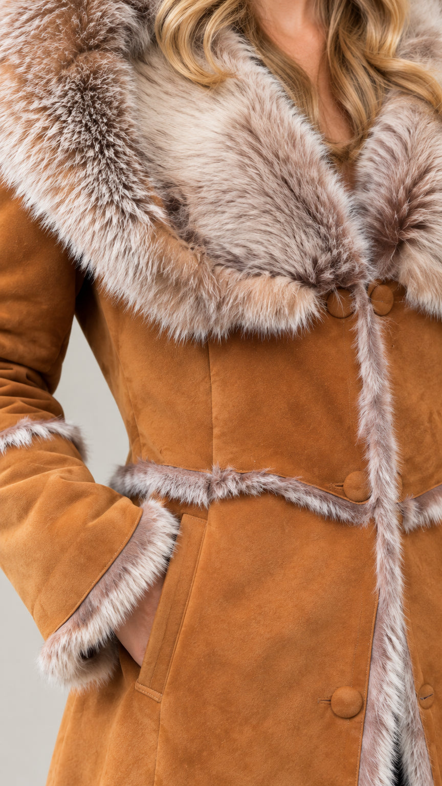 Close up detail of faux fur collar and trim on camel faux suede coat with pocket