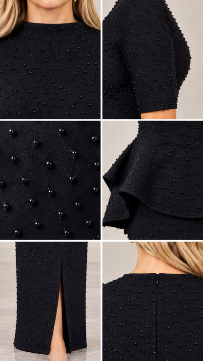 Close-up details of black textured fabric, tonal pearl beads, peplum waist, front slit, and back zipper