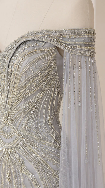 Close-up detail of shoulder beading, crystals, and delicate draped fringe