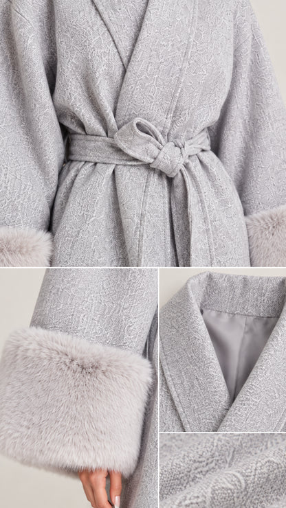 Close-up details of textured grey fabric, self-tie belt, lining, and plush faux fur cuff