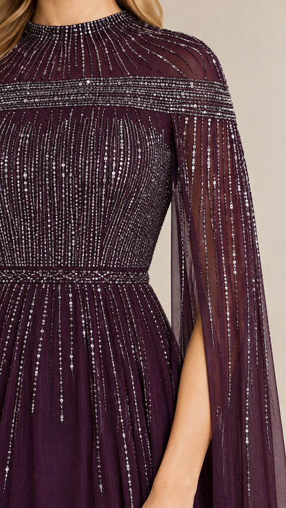 Close-up of sparkling linear beading and high mock neckline on plum gown
