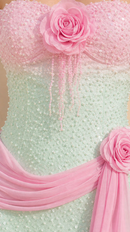 Close-up detail of 3D pink rose corsage with beaded fringe and shimmering mint green sequins