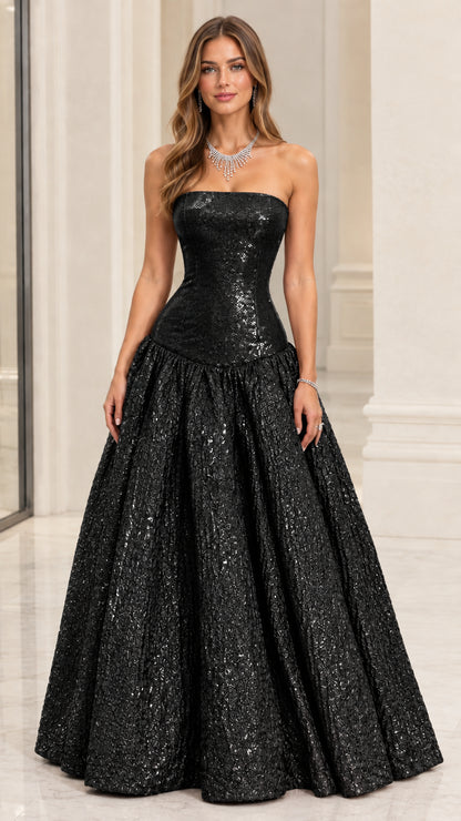 Model wearing Black strapless drop-waist metallic evening ball gown