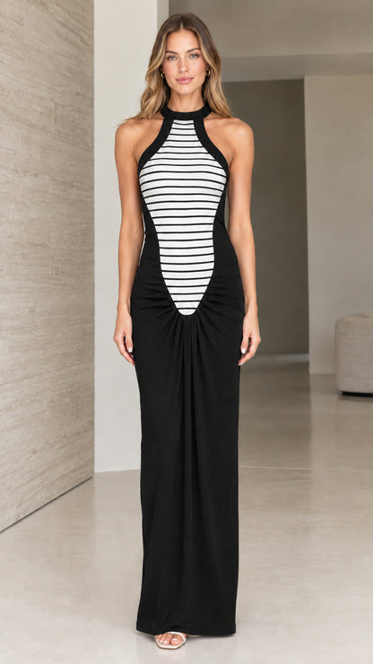 Full front view of black striped spliced halter neck maxi dress