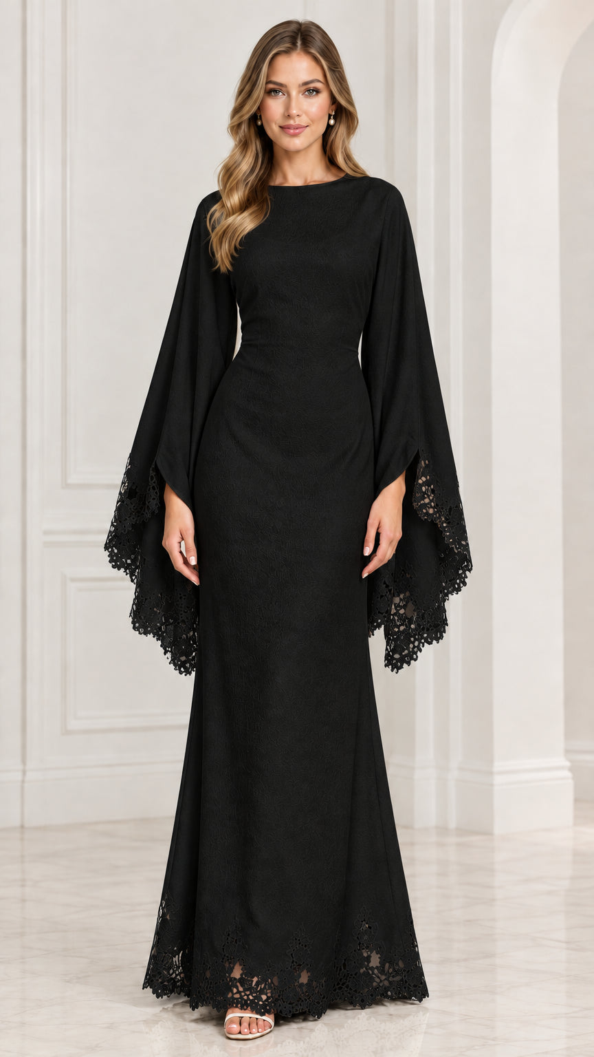 Front view of model wearing black cape sleeve evening maxi dress with lace trim