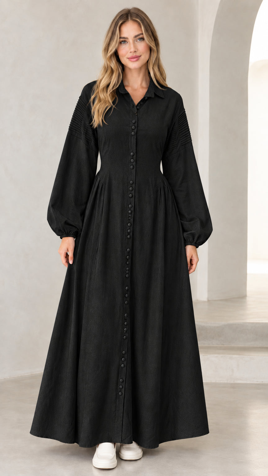 Front view of woman wearing black pleated shoulder button-down maxi shirt dress