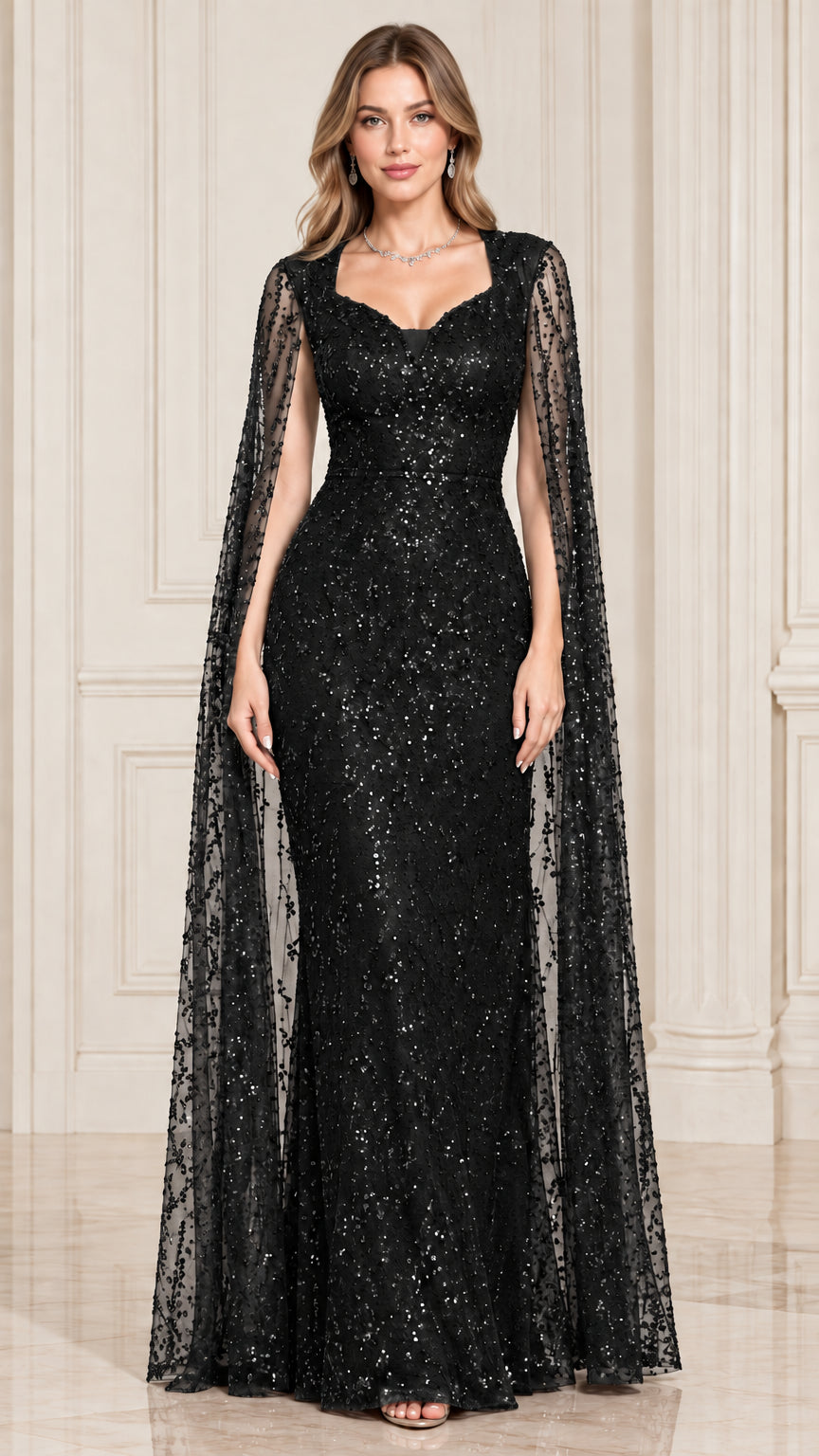 Front view of black sequined evening gown with dramatic cape sleeves