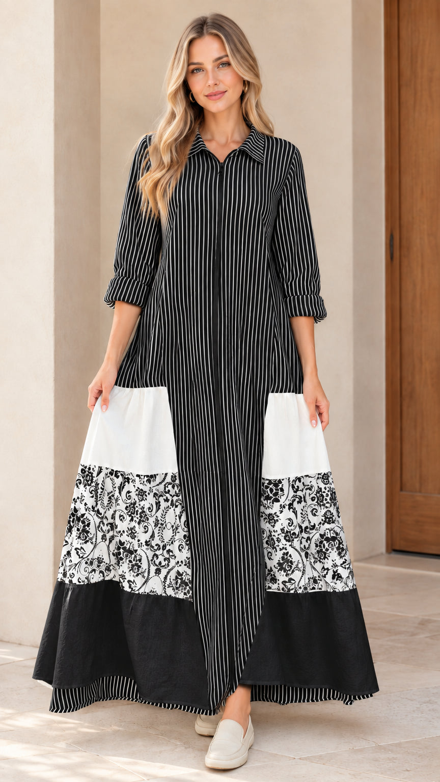 Front view of women's black striped zip-front maxi dress with floral patchwork