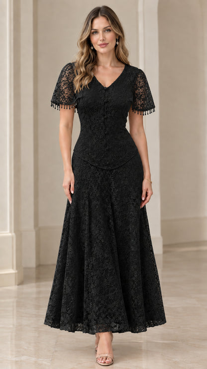 Front view of model in black floral lace V-neck maxi evening dress