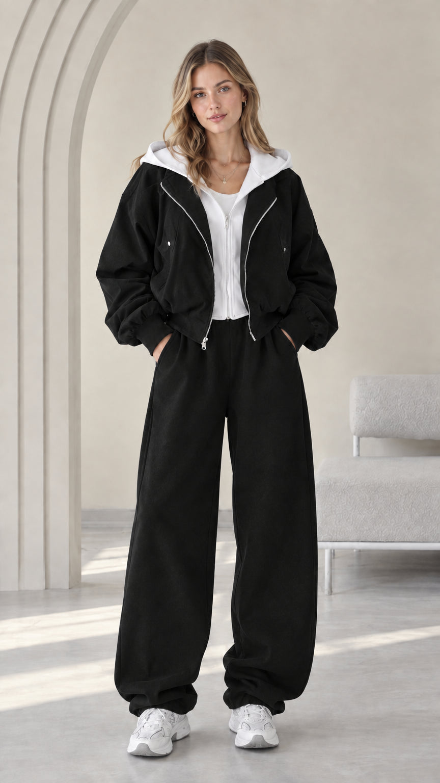 Front view of model wearing the Black contrast hooded zip jacket and wide-leg pants set