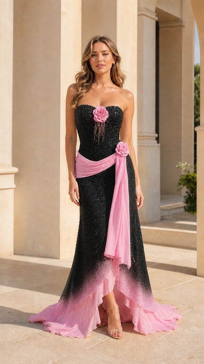 Full-length front view of black and pink ombré strapless sequined evening gown